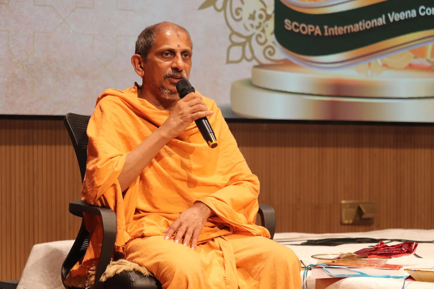 Seer addressing the conference