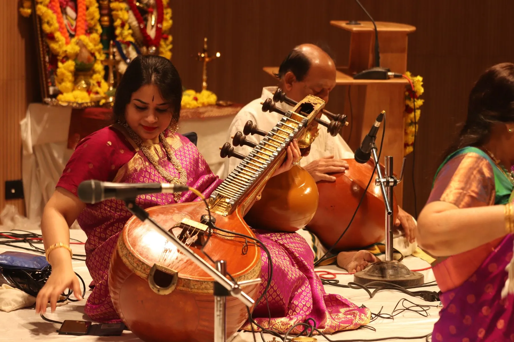 Vainika close with flowers and accompanist