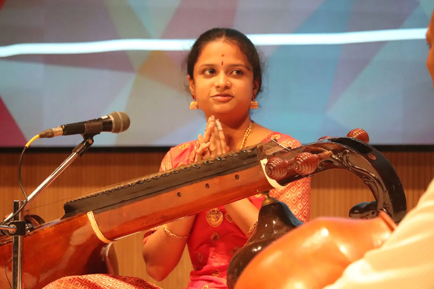 Young vainika, namaste to audience
