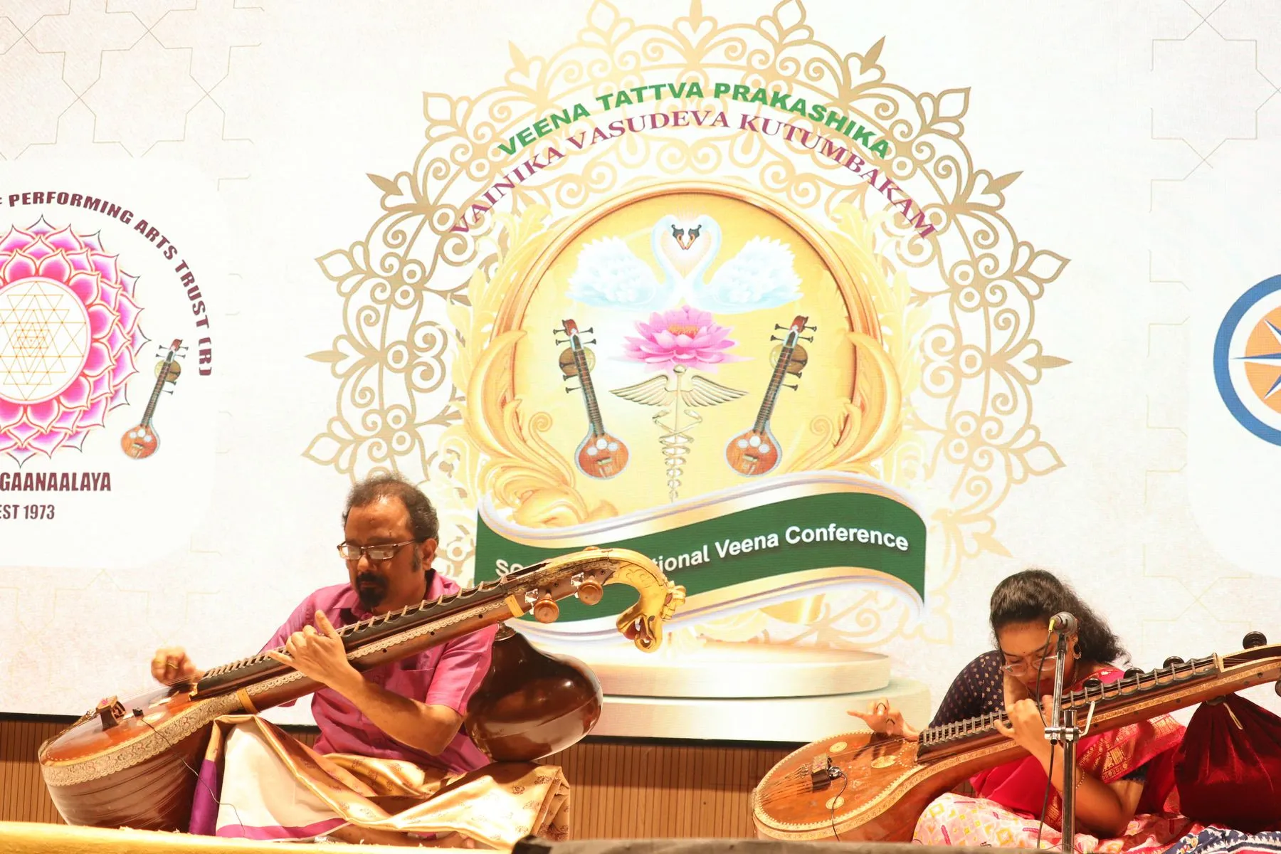 Ensemble with logo backdrop