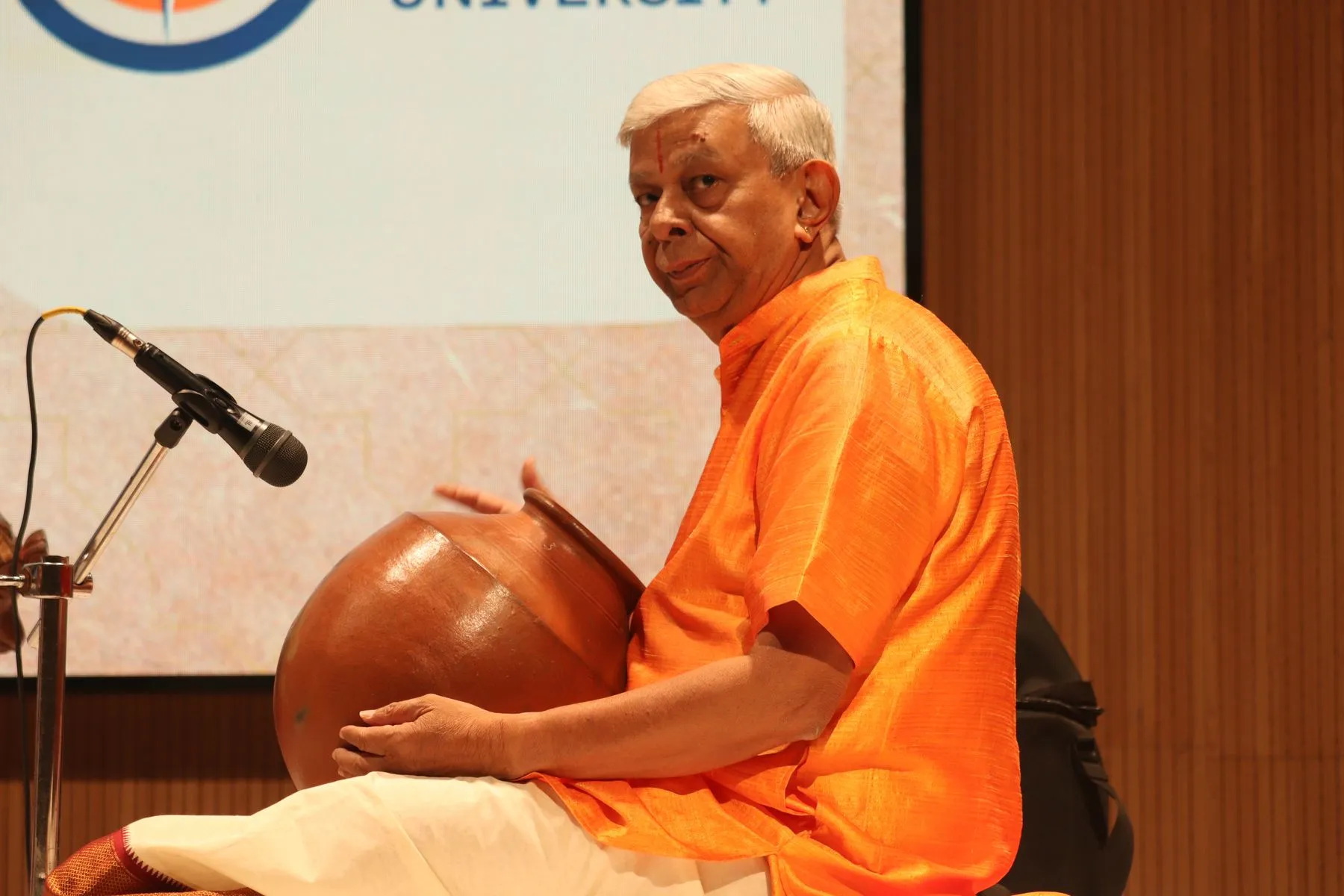 Senior ghatam artist, smiling
