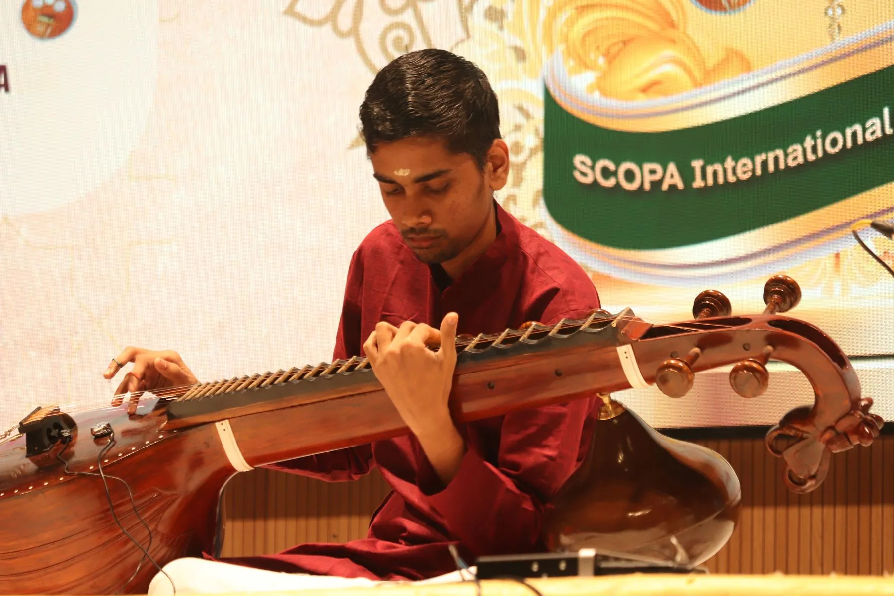Young vainika with SCOPA banner