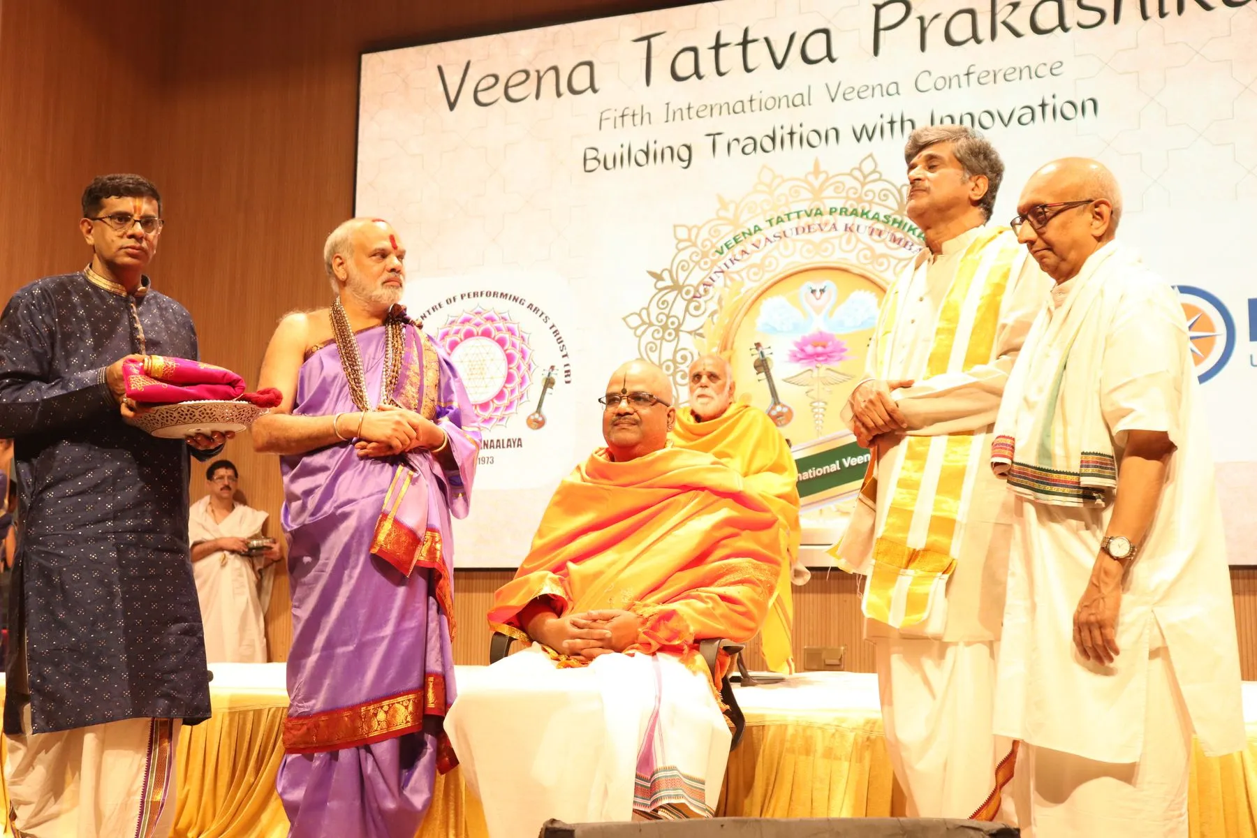 Group felicitation with VTP V backdrop