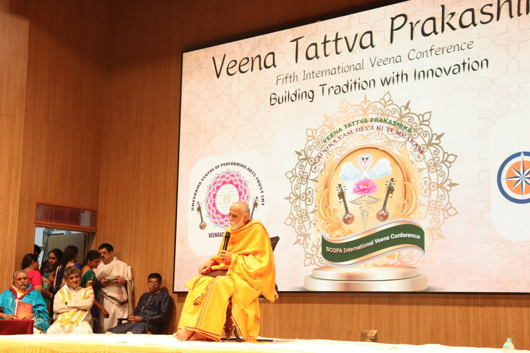Seer addressing hall under VTP V backdrop
