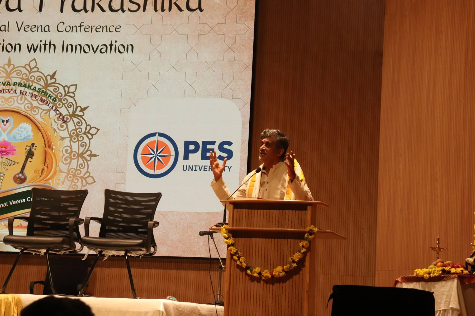 Speaker at podium, VTP V backdrop