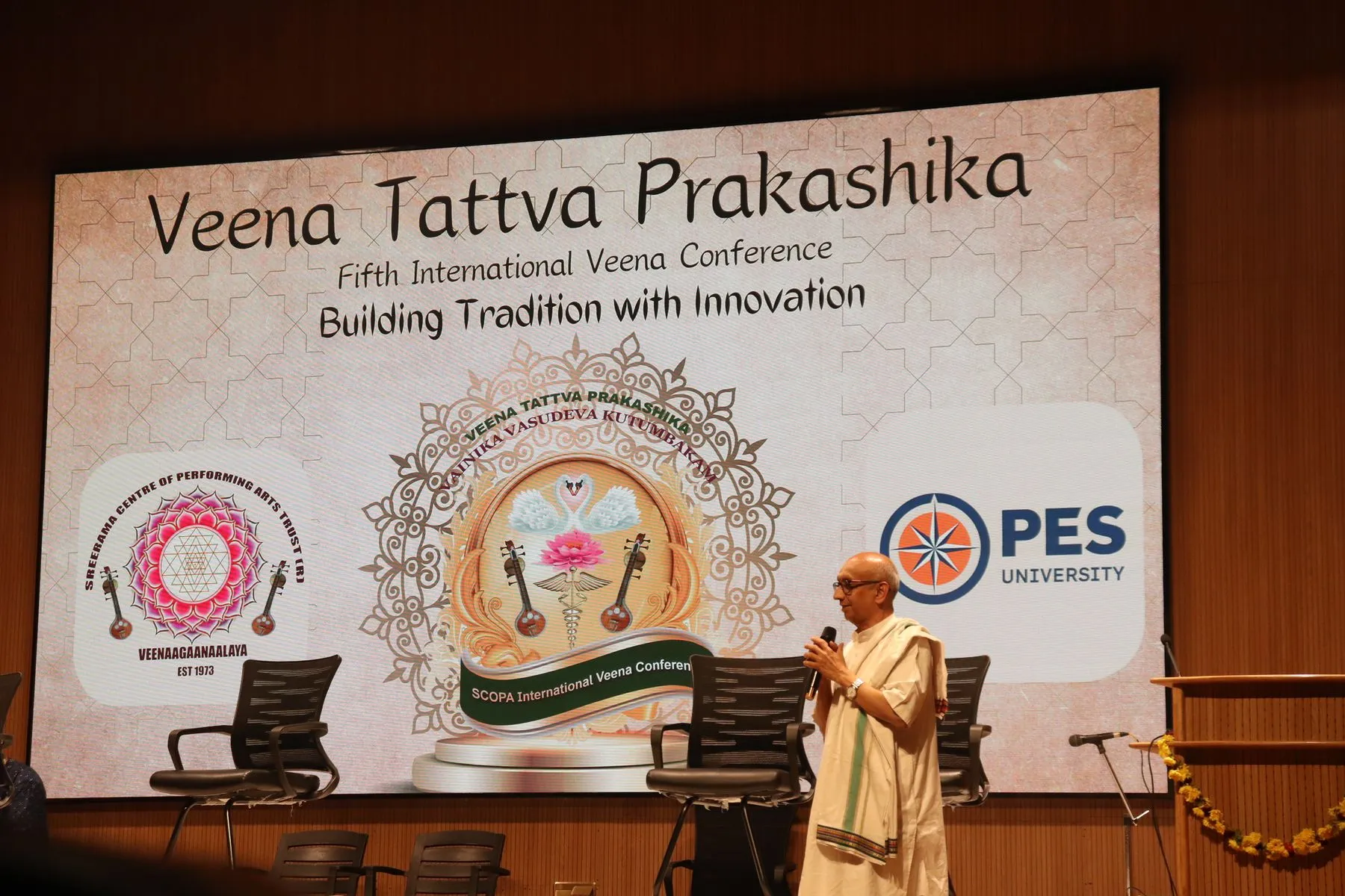 Speaker at VTP V backdrop, wide