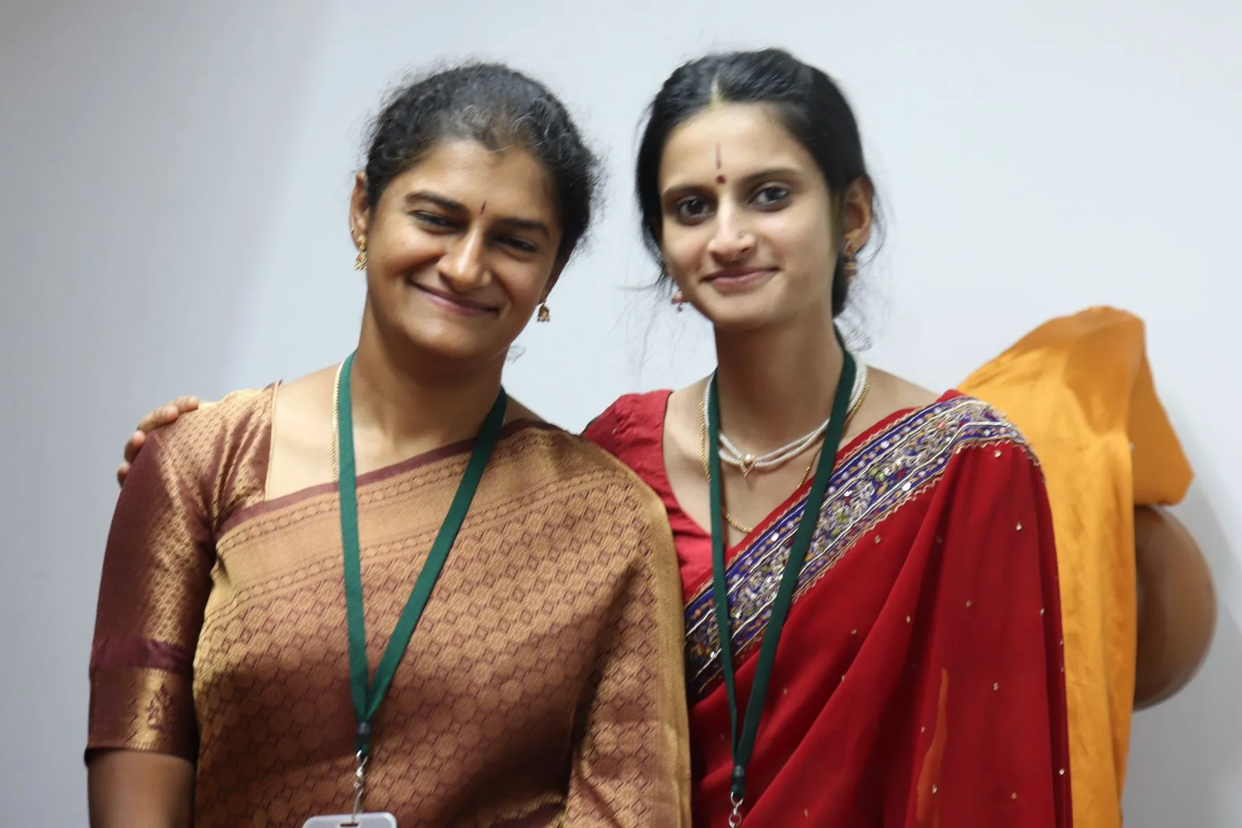 Two volunteers smiling