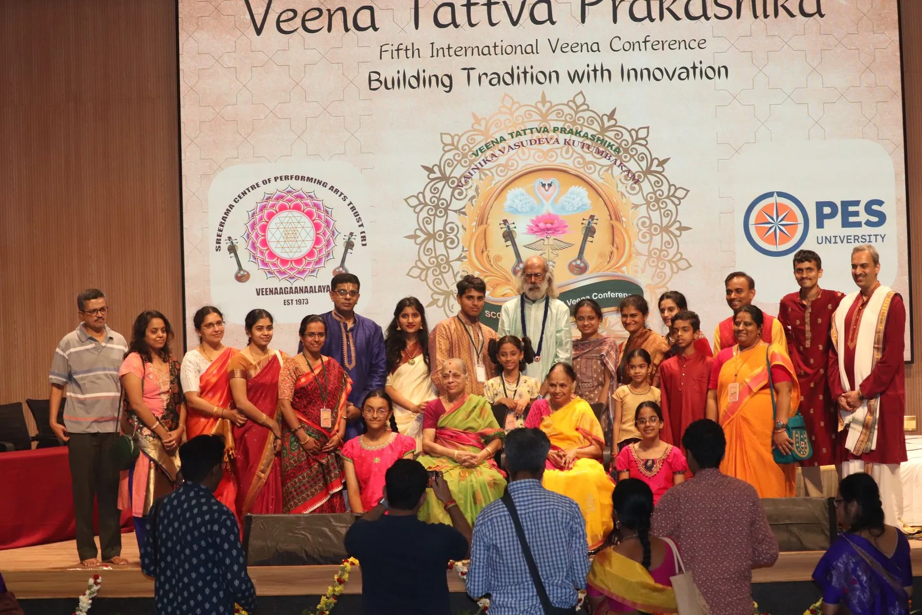 Student group on stage with VTP V backdrop
