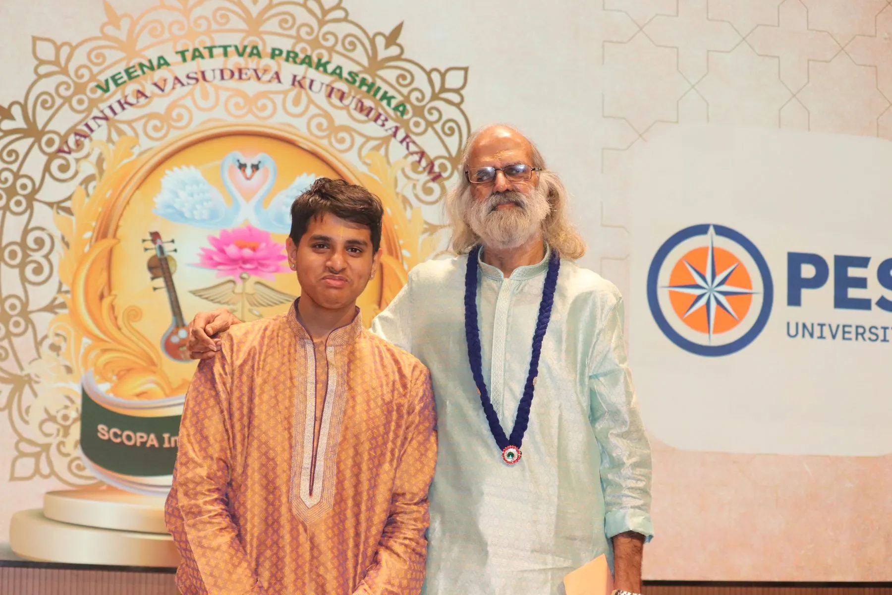 Elder with student, backdrop