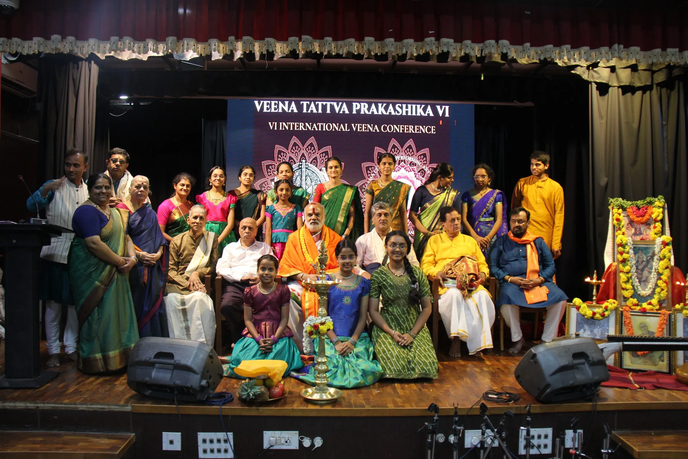 Artists, scholars and organizers gathered on stage beneath the VTP VI backdrop