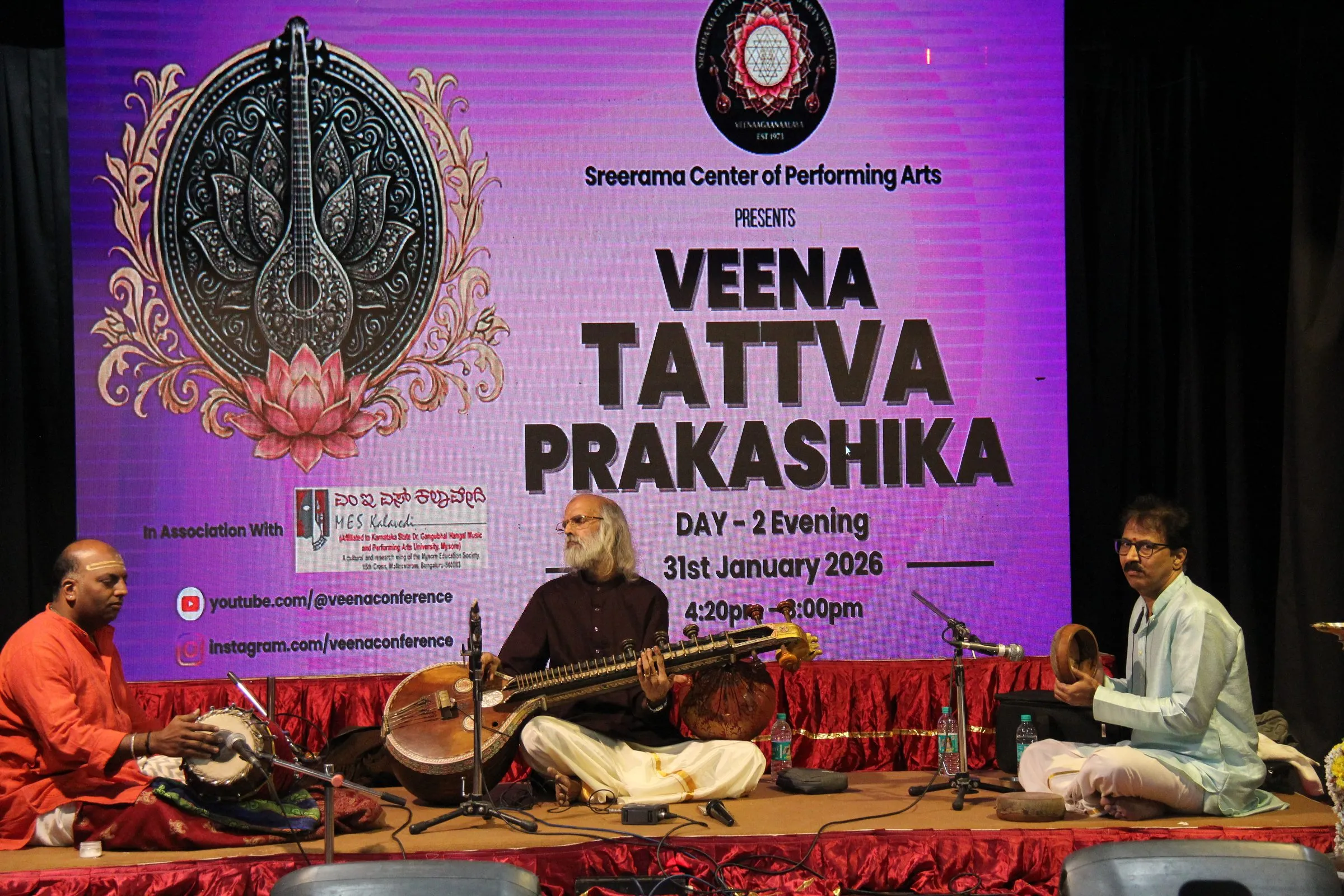 A veena concert with percussion accompaniment in front of the Day 2 evening stage screen